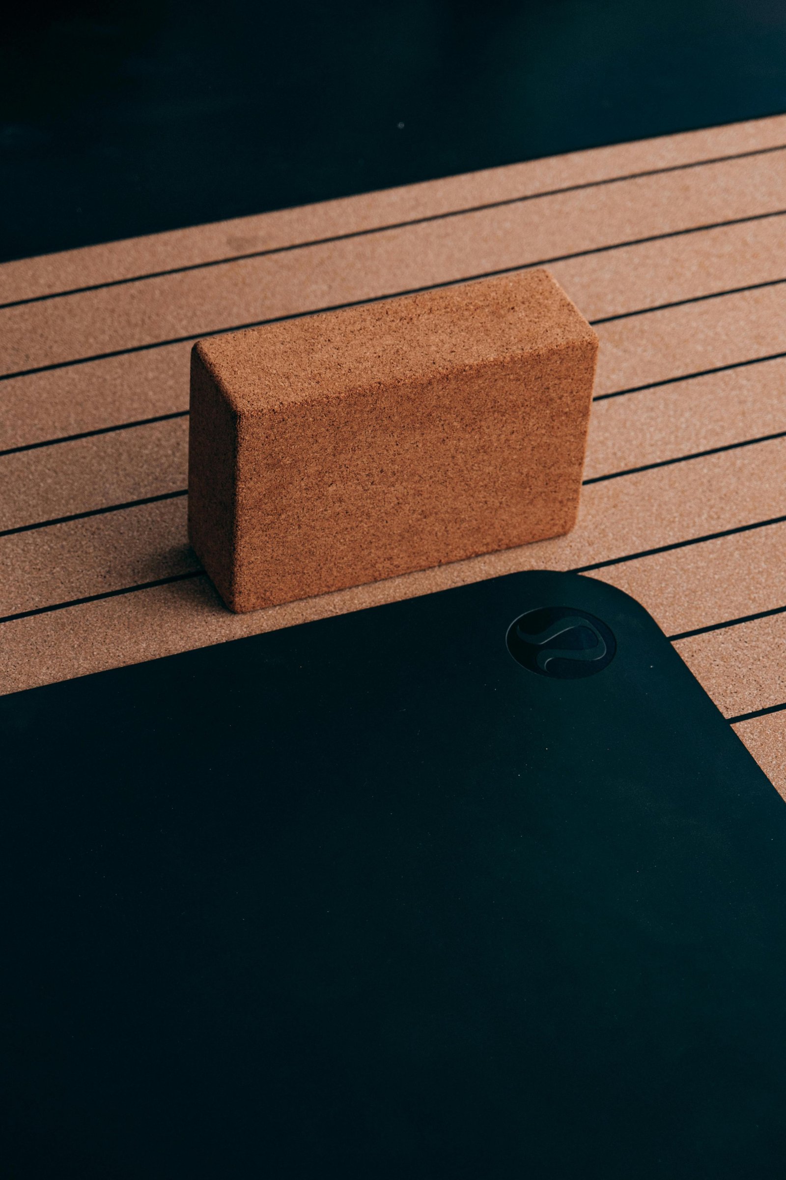 Cork yoga block and mat in soft natural light — movement and practice